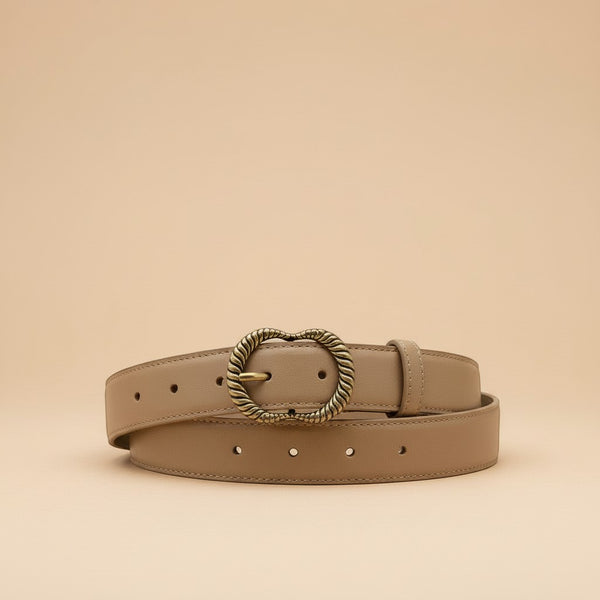 André Zestia beige genuine leather belt with ornate gold heart-shaped buckle. Minimalist design for natural elegance.
