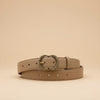 André Zestia beige genuine leather belt with ornate gold heart-shaped buckle. Minimalist design for natural elegance.