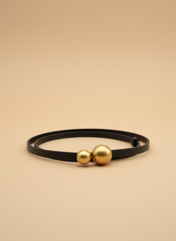 André black leather belt with a distinctive gold double ball buckle. Thin strap, adjustable.