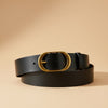 André Minerae black leather belt with gold oval buckle. Structured design, ideal for blazers and dresses.