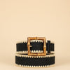 André black woven paper belt with a square bamboo buckle and zigzag trim. Adjustable strap.