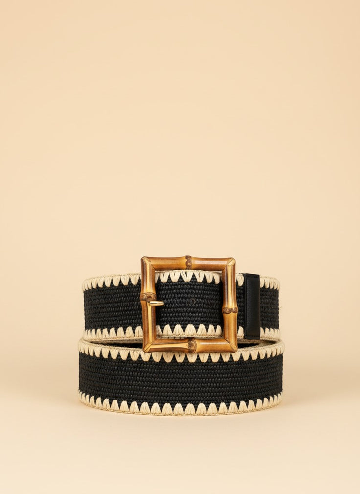 André black woven paper belt with a square bamboo buckle and zigzag trim. Adjustable strap.