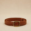 André Nerea camel braided genuine leather belt with antique gold buckle. Adjustable fit for a refined bohemian-chic style.