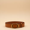 André Minerae camel leather belt with oval gold buckle, perfect for everyday chic.