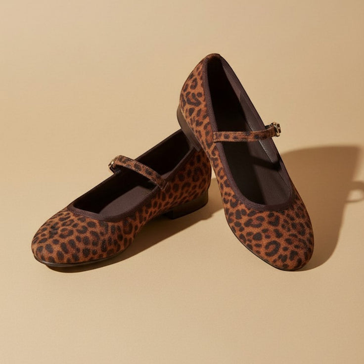 André brown leopard print leather ballet flats with adjustable strap and gold buckle. Made in Portugal.