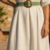 André Oasia kaki woven paper belt with wooden buckle and cream trim. Perfect for dresses and linen trousers.