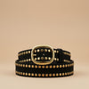 André Ocea tan leather belt with gold studs and oval buckle. Rock-chic style accessory.