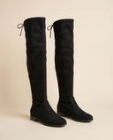 Paire de bottes NIMUE noires debout sur fond beige