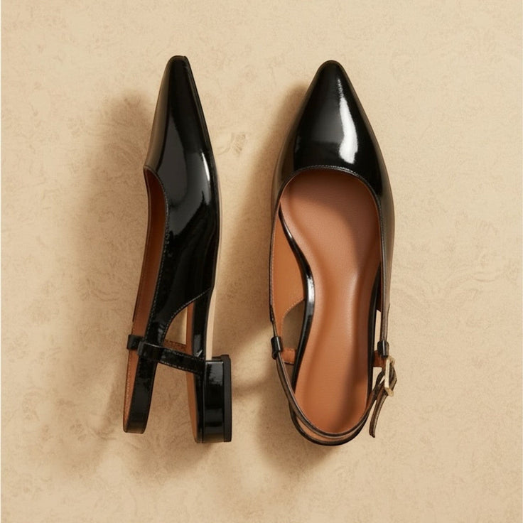 André black patent leather slingback heels with pointed toe and ankle strap. Comfortable flat sole.